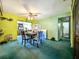 The dining room features bright walls and an open connection to the kitchen at 6350 55Th N Ave, St Petersburg, FL 33709