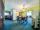 View of the dining room with open access to the living room and kitchen at 6350 55Th N Ave, St Petersburg, FL 33709