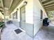 Covered front entrance featuring decorative front door and sidelight windows at 6350 55Th N Ave, St Petersburg, FL 33709