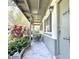 Charming covered front porch with decorative plants and quaint architectural details at 6350 55Th N Ave, St Petersburg, FL 33709