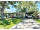 Charming single story home with covered carport and mature landscaping at 6350 55Th N Ave, St Petersburg, FL 33709