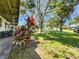 Well maintained front yard featuring mature trees and attractive landscaping at 6350 55Th N Ave, St Petersburg, FL 33709