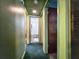 Hallway view to rooms, showing the bathroom ahead and neutral wall paint at 6350 55Th N Ave, St Petersburg, FL 33709