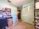 Hallway view leading to rooms, featuring a closet with sliding doors and a vintage radio on a shelf at 6350 55Th N Ave, St Petersburg, FL 33709