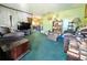 Cozy living room with ample seating and open access to the dining area and kitchen at 6350 55Th N Ave, St Petersburg, FL 33709