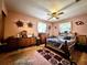 Cozy main bedroom with unique furnishings, including rustic wooden decor and a ceiling fan at 6350 55Th N Ave, St Petersburg, FL 33709