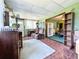 Relaxing sun room features brick flooring, bright light, and seamless connection to the outdoors at 6350 55Th N Ave, St Petersburg, FL 33709