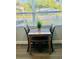 Charming dining area with table for two and window offering serene neighborhood views at 6401 30Th N Way, St Petersburg, FL 33702