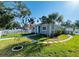 Beautiful home with a well-manicured lawn, a stone walkway, an American flag and a picket fence at 6401 30Th N Way, St Petersburg, FL 33702