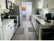 Open kitchen featuring modern appliances, sleek countertops, and ample natural light at 6401 30Th N Way, St Petersburg, FL 33702