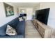 Comfortable living area featuring a sofa, TV, and desk space, ideal for relaxation and work at 6401 30Th N Way, St Petersburg, FL 33702