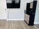 Efficient living space with a built-in kitchenette, modern microwave, and a wall-mounted television for entertainment at 6401 30Th N Way, St Petersburg, FL 33702