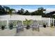 Relax on the patio with white picket fence, two chairs, and a variety of potted plants at 6401 30Th N Way, St Petersburg, FL 33702