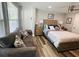 Inviting studio with a sofa, a comfortable bed, and wood-look flooring, creating a modern and welcoming space at 6401 30Th N Way, St Petersburg, FL 33702