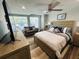 Well-designed studio with a cozy couch, a comfortable bed, and modern flooring, offering a welcoming and functional living space at 6401 30Th N Way, St Petersburg, FL 33702