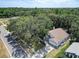 Aerial view of a well maintained house surrounded by mature trees in a quiet neighborhood at 6410 Beaver Way, Tampa, FL 33625