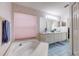 Bathroom featuring a soaking tub, double sink vanity, and a separate shower at 6410 Beaver Way, Tampa, FL 33625