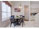 Cozy dining area featuring a chandelier and a window with views of the outdoors at 6410 Beaver Way, Tampa, FL 33625