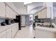 Kitchen featuring ample counter space and views into adjoining rooms at 6410 Beaver Way, Tampa, FL 33625