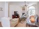 Inviting living room featuring vaulted ceilings, fireplace, and a sliding glass door to the pool at 6410 Beaver Way, Tampa, FL 33625
