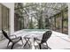 Relaxing pool area featuring a screened enclosure and comfortable seating at 6410 Beaver Way, Tampa, FL 33625