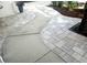 A beautiful walkway is landscaped with brick pavers and concrete sections. A tree stands beside it at 6410 Beaver Way, Tampa, FL 33625