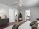 Spacious bedroom featuring doors leading to the bathroom and study at 7280 Tarrytown Dr, Spring Hill, FL 34606