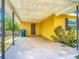 Spacious carport providing covered parking and shelter from the elements with access to the house at 7280 Tarrytown Dr, Spring Hill, FL 34606