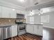 Bright kitchen features stainless steel appliances, mosaic tile backsplash, and granite countertops at 7280 Tarrytown Dr, Spring Hill, FL 34606