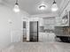 Modern kitchen showcasing stainless steel appliances, granite countertops, and stylish white cabinetry at 7280 Tarrytown Dr, Spring Hill, FL 34606