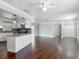 Bright, open-concept living area with modern fixtures, hardwood floors, and seamless flow to the kitchen at 7280 Tarrytown Dr, Spring Hill, FL 34606