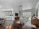 Open-concept living area with sliding doors to sunroom, seamlessly connecting to the dining and kitchen at 7280 Tarrytown Dr, Spring Hill, FL 34606