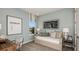 Serene bedroom boasts soft colors, cozy decor, and a tranquil ambiance at 733 Sky Shade Dr, Apollo Beach, FL 33572