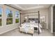 Inviting main bedroom features a tray ceiling, plush carpeting, and plenty of natural light at 733 Sky Shade Dr, Apollo Beach, FL 33572