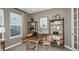 Inviting home office with wood desk, shelving and coastal decor provides a comfortable workspace at 733 Sky Shade Dr, Apollo Beach, FL 33572