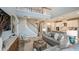 Stylish living room and open kitchen with modern furnishings and plenty of natural light at 735 Sky Shade Dr, Apollo Beach, FL 33572