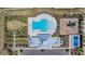 A full aerial view of the community recreation area, with pool, playground, and pickleball court at 754 8Th Nw St, Ruskin, FL 33570