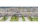 Neighborhood aerial view showcasing landscaping and symmetrical home placement at 754 8Th Nw St, Ruskin, FL 33570