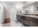This bathroom features double sinks, granite countertops, and a shower with modern fixtures at 754 8Th Nw St, Ruskin, FL 33570