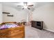 Bedroom featuring a wooden bed frame, colorful curtain, and neutral paint for a cozy and inviting space at 754 8Th Nw St, Ruskin, FL 33570