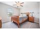 Cozy bedroom features plush carpet, a wood bed frame, and natural light for a comfortable and inviting space at 754 8Th Nw St, Ruskin, FL 33570