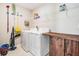 A functional laundry room with a washer, dryer, and storage options at 754 8Th Nw St, Ruskin, FL 33570