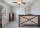 Bright office space featuring a white board, modern ceiling fan, and a wooden desk, perfect for a home work space at 754 8Th Nw St, Ruskin, FL 33570