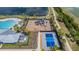 Community amenities include a pool, playground, and pickleball court, all surrounded by palm trees at 754 8Th Nw St, Ruskin, FL 33570