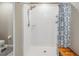 This bathroom features a tiled shower, rainfall showerhead, and toiletry storage at 754 8Th Nw St, Ruskin, FL 33570