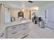 Bright kitchen offering great sight lines, featuring white cabinetry, and views of the dining area at 7542 20Th N St, St Petersburg, FL 33702