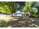 This backyard features a screened pool and mature trees at 7919 Rusty Oak Dr, New Port Richey, FL 34653