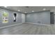 Bright living room featuring new vinyl flooring, recessed lighting, and updated paint at 7919 Rusty Oak Dr, New Port Richey, FL 34653