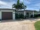 Charming single-story home featuring a well-manicured yard and a spacious driveway at 7952 1St S Ave, St Petersburg, FL 33707