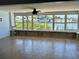 Waterfront living room featuring expansive windows offering stunning views and lots of natural light at 7952 1St S Ave, St Petersburg, FL 33707